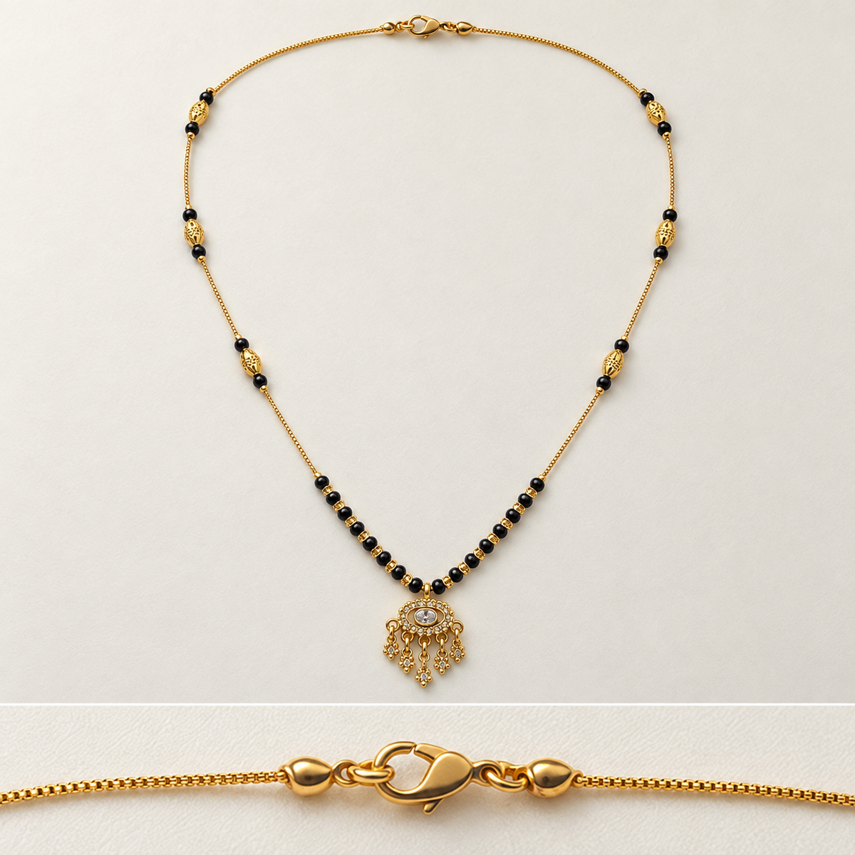 Gold beaded necklace with a central filigree pendant featuring a clear stone, shown on a light background with a close-up inset of the lobster clasp.