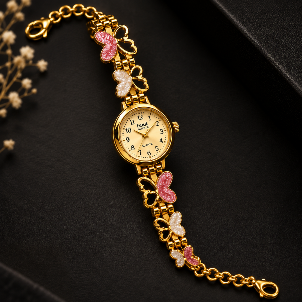 Pink and white enamel butterfly charm detail on gold bracelet watch