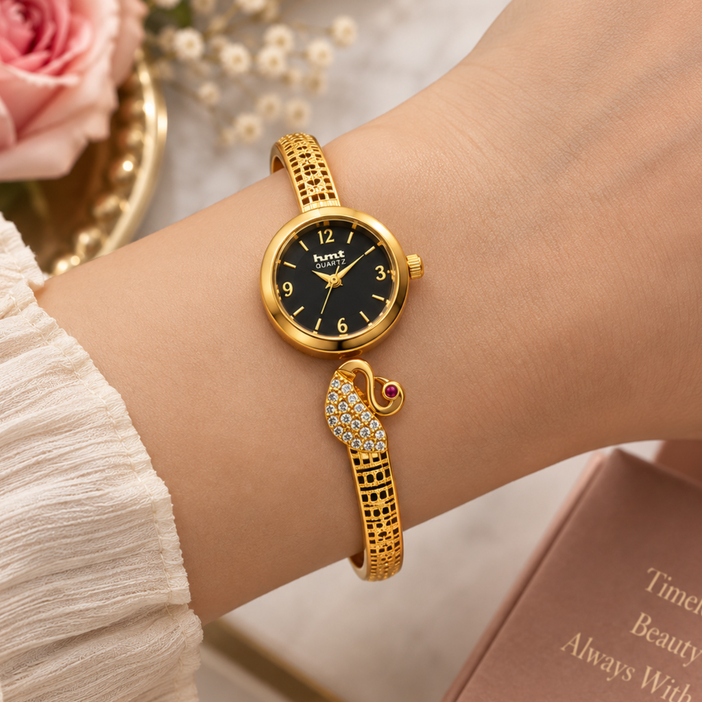 Woman wearing gold crystal peacock bangle watch black dial