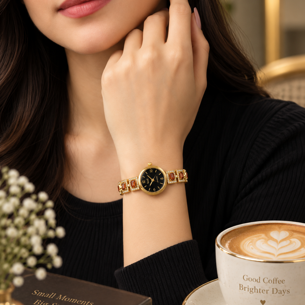 Woman wearing gold garnet crystal bracelet watch black dial