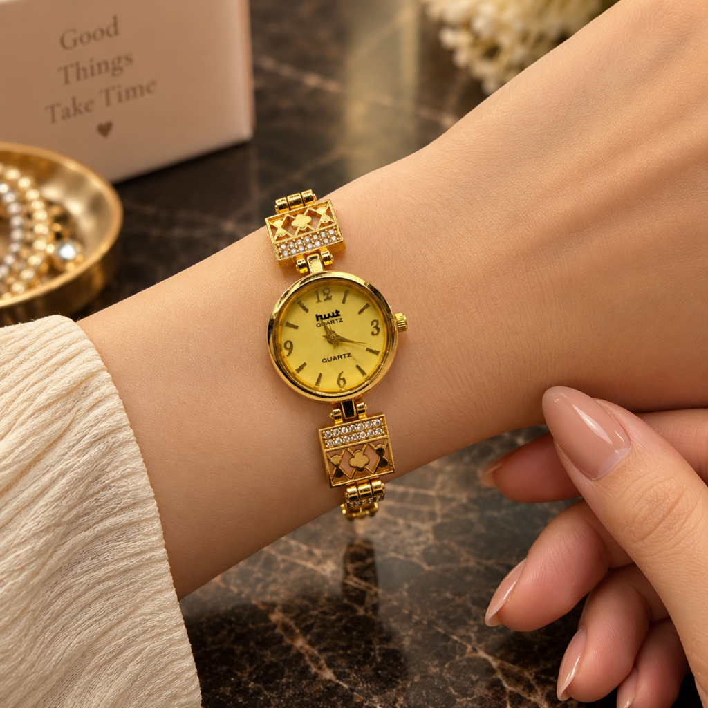 Woman wearing gold plated crystal clover lattice bracelet watch