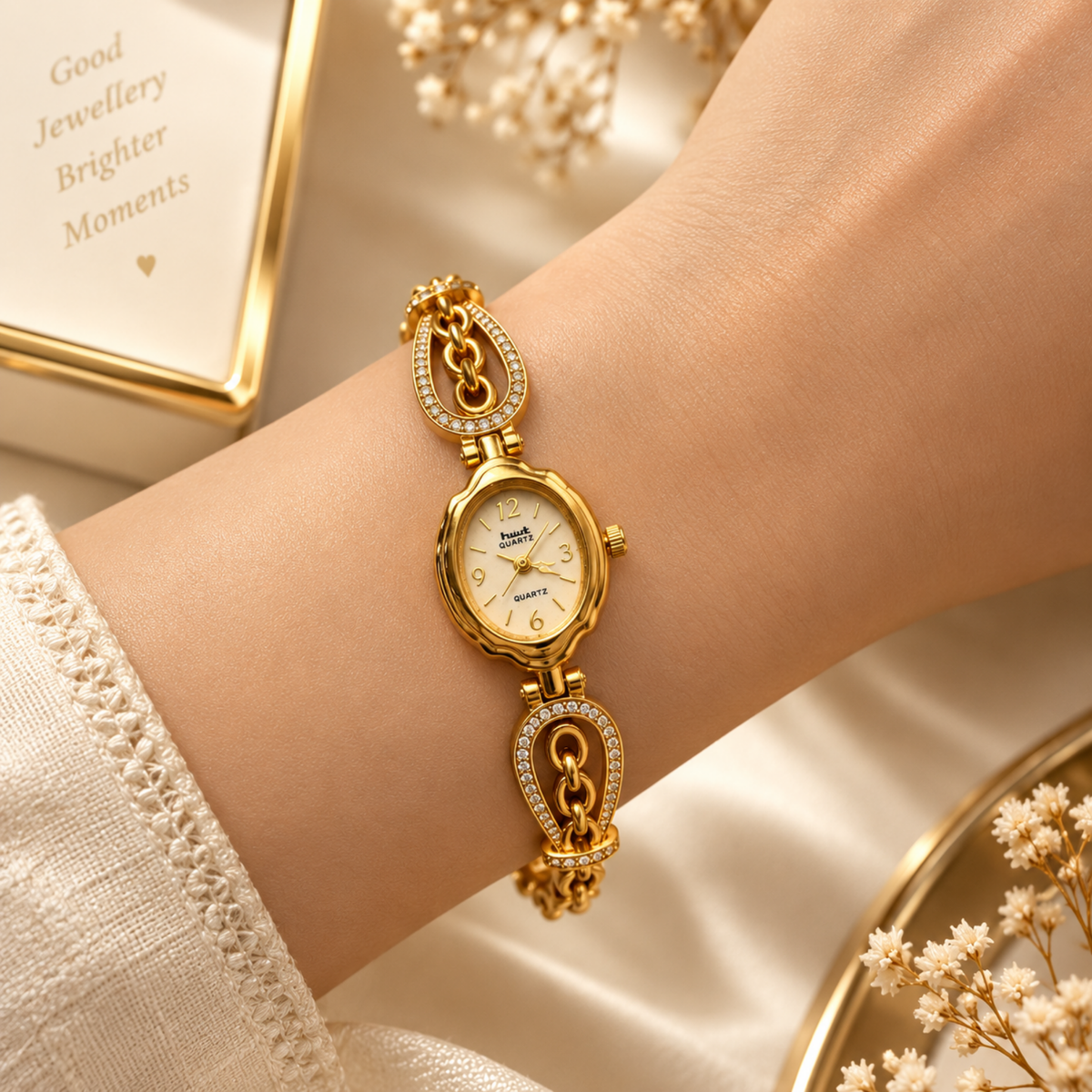 Woman wearing gold plated oval crystal chain bracelet watch